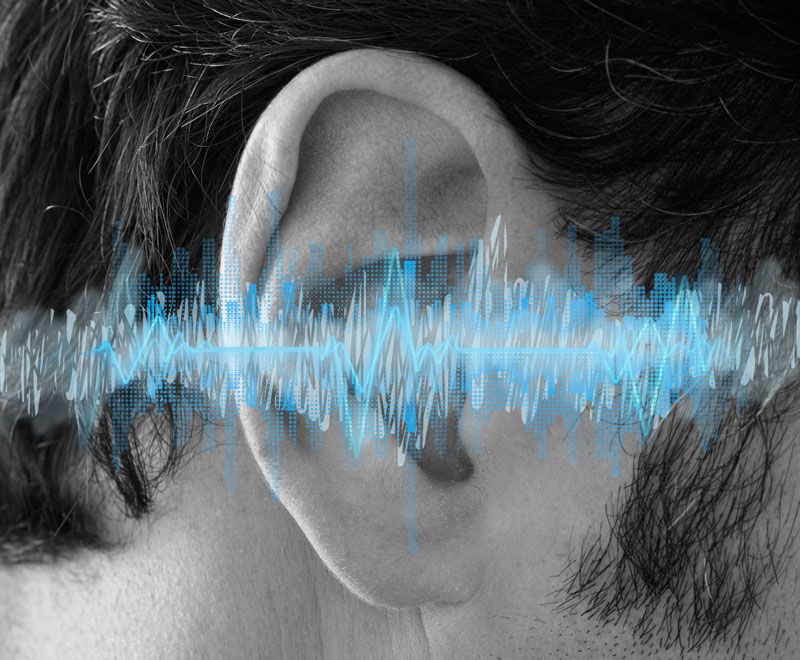 An ear with a diagram of sound waves placed over it to emulate tinnitus management